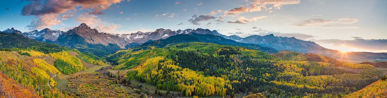 Sunset panorama of fall colors and the Sneffels Range in the San Juan Mountains of Colorado.