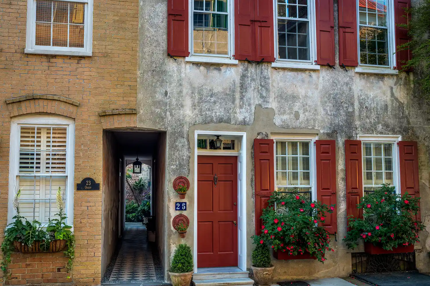 Two historic homes in Charleston's historic district, connected at upper levels.