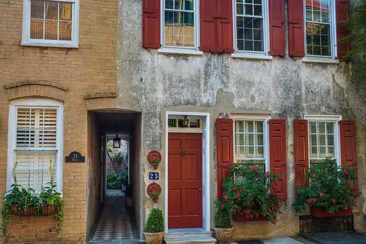 Workshop location, Charleston, SC; Two adjoined, multi story historic homes with a street level, open corridor between them to side entrances and back yards.