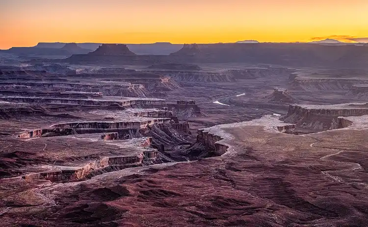 The White Rim weaving through the canyon landscape below Green River Overlook in Canyonlands National Park.