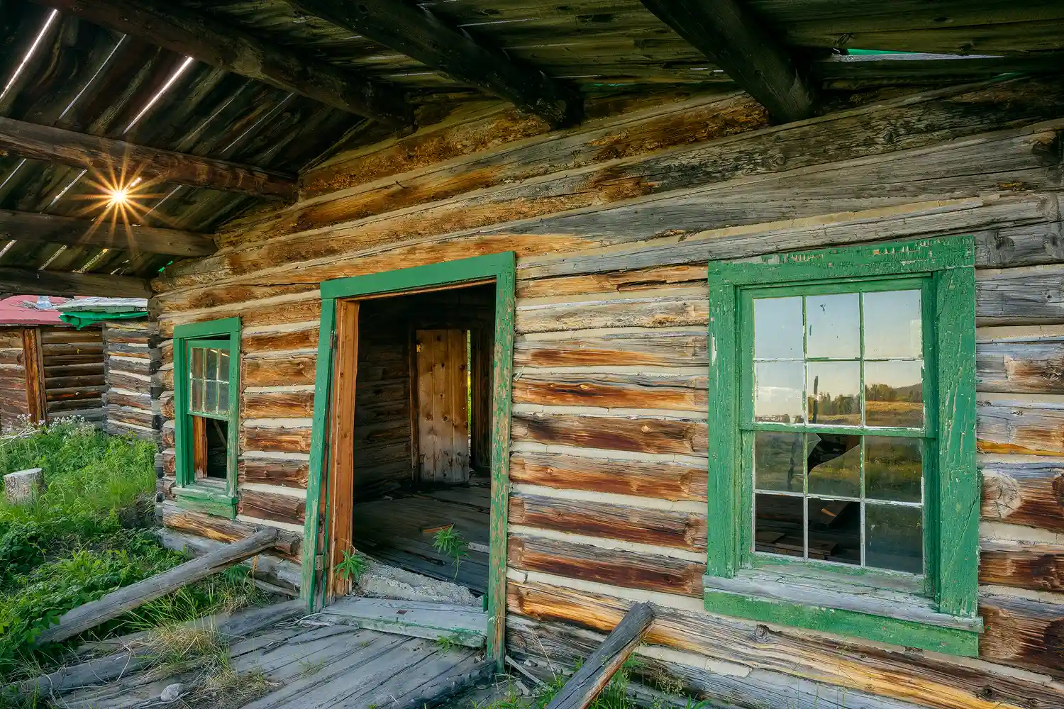 The historic Bar BC Ranch buildings at sunset.